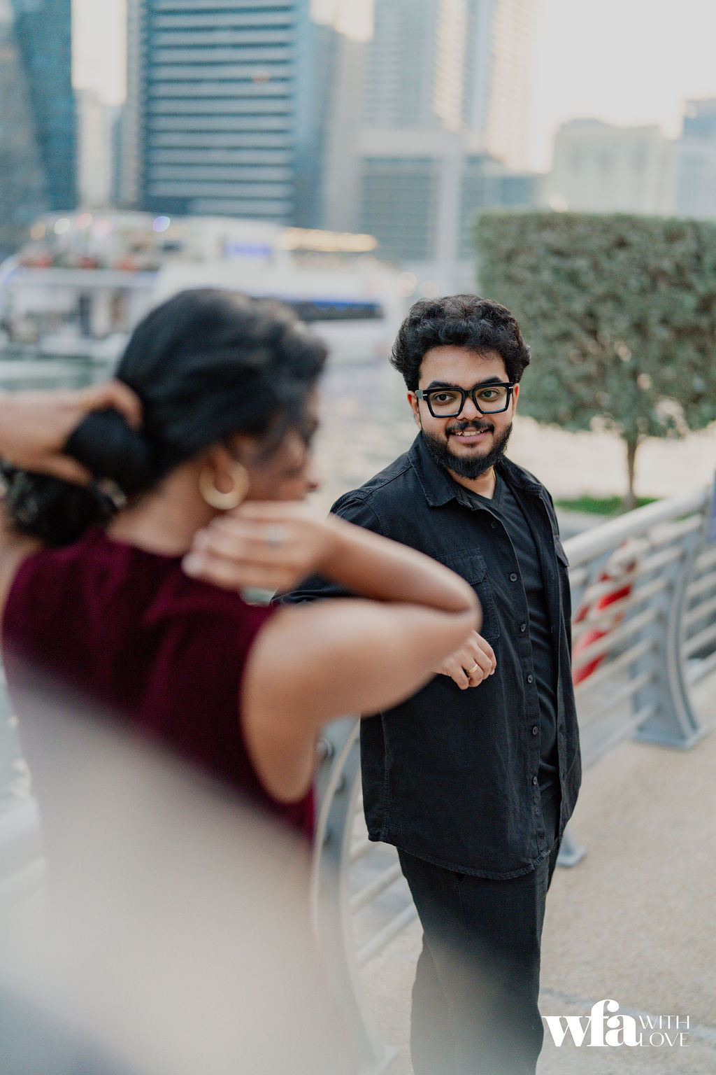 Groom smiling toward his bride